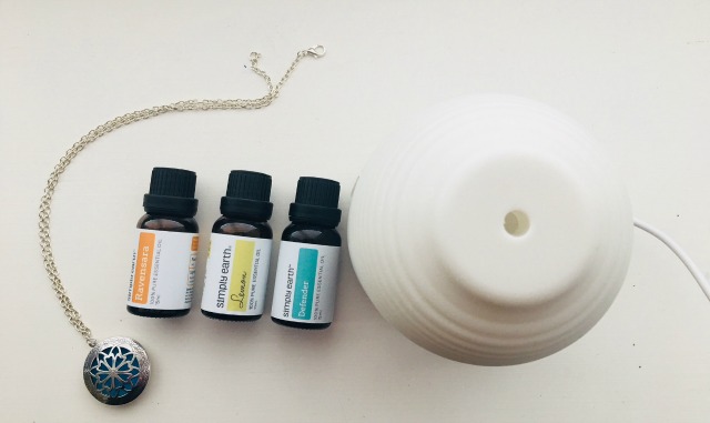 Diffuser and Diffuser Necklace with lemon, defender and raven essential oils.